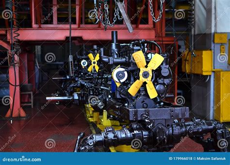 New Engines On Assembly Line Of Industrial Factory Tractor Manufacture