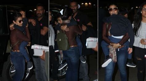 In Pics Actress Kajol Carries A Sleepy Son Yug At The Airport Along