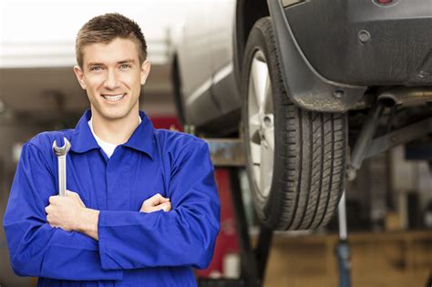 Happy Car Mechanic Holding Wrench Fast Track Auto Repair