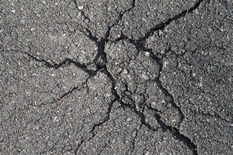 Cracks In The Asphalt Texture Of Bad Asphalt The Consequences Of The