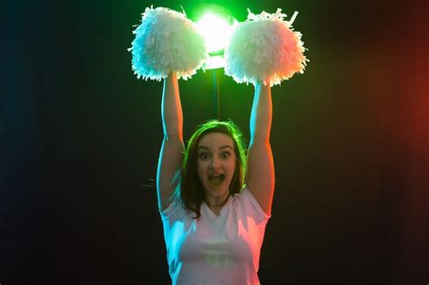 Premium Photo Full Length Portrait Of Cheerleader Dancing With Pom Poms