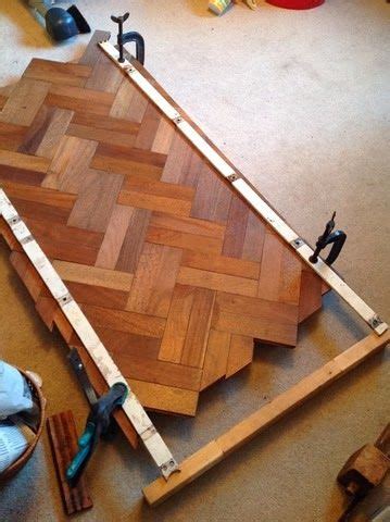 Decorative parquet flooring ties in perfectly with the dark wooden sculptured island legs, which explore the beautiful parquet flooring photo gallery and find out exactly why houzz is the best. parquet table recycle | Reclaimed parquet flooring, Diy ...
