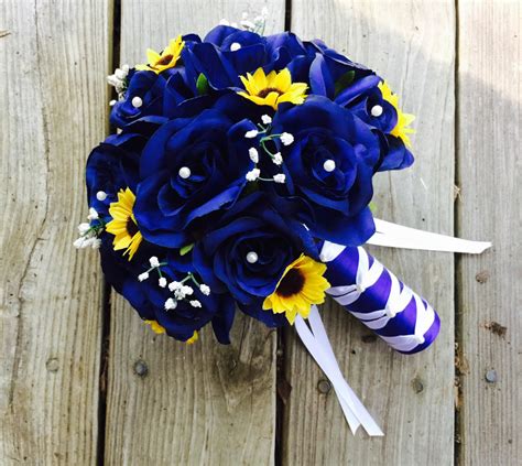 A Bridal Bouquet With Sunflowers And Blue Roses