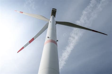 Modern Wind Turbine View From Low Angle During Daylight Stock Photo