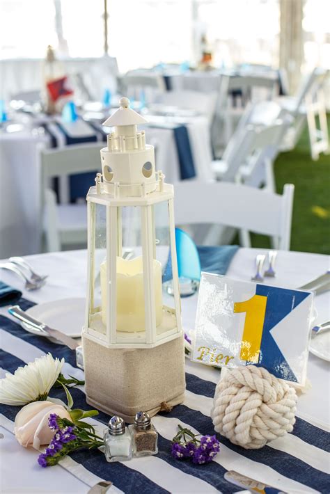 Nautical Centerpieces With Lighthouses And Monkeys Fist Rope Table