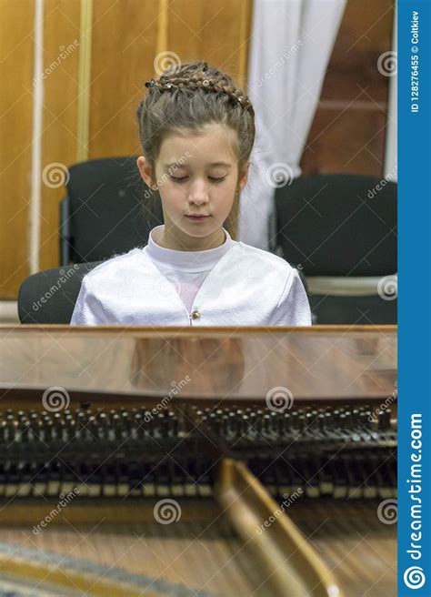 Little Girl Playing The Grand Piano Vertical Photo Stock Image Image