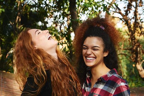 Girls Laughing Out Loud In Park By Stocksy Contributor Guille Faingold Stocksy