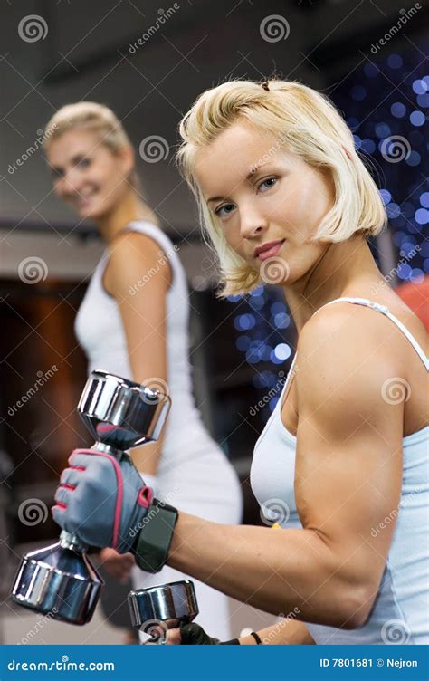Strong Beautiful Woman Flexing Biceps Royalty Free Stock Photography