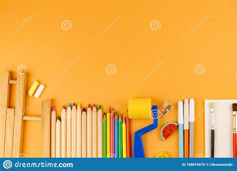Various School Supplies On Orange Background Ready For Your Design