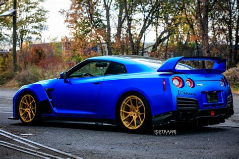 Outstanding Blue Nissan Gt R With Custom Vented Hood And Gold Rims
