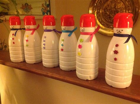 Coffee can christmas craft ideas. Snowmen made from coffee creamer containers & filled with treats | Coffee creamer bottle crafts ...