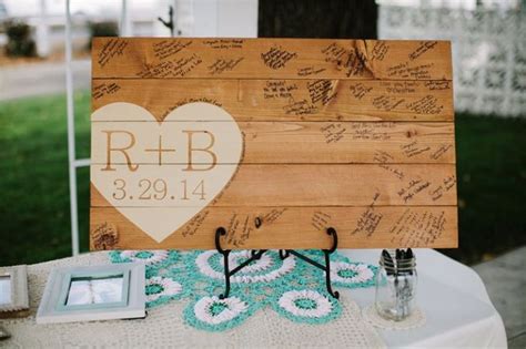Polaroid camera guest book at wedding in springfield, missouri. Sign Me: 20 Creative Wedding Guest Book Ideas - EverAfterGuide