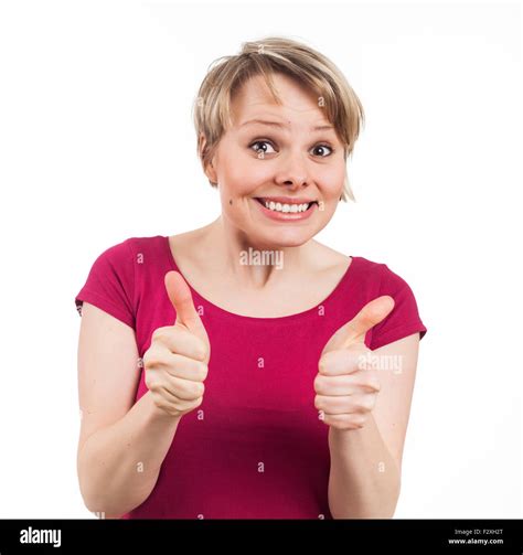 Young Woman Showing Her Thumbs Up And Having A Pretty Smile Isolated