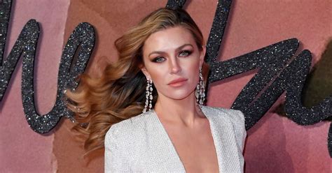 Abbey Clancy Flashes Acres Of Cleavage In Plunging Gown As She Ignores