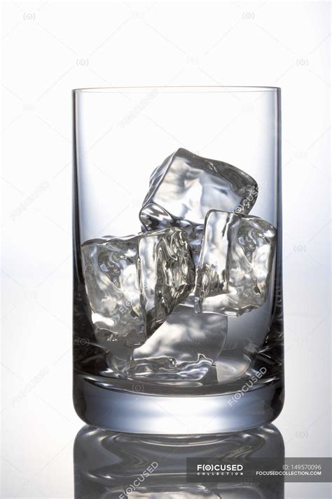 Ice Cubes In Glass — Aqua Isolated Stock Photo 149570096