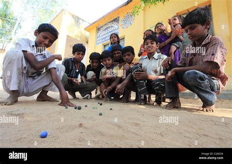 Indian Boys Playing With Marbles Andhra Pradesh South India Stock Photo