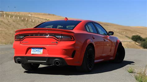 To jump start a car with cables, follow these steps: 2020 Dodge Charger SRT Hellcat Widebody Review: The Joy of Aging Gracefully