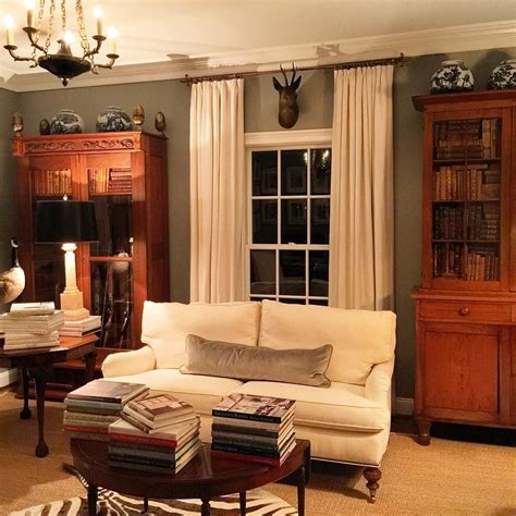 If you don't want to paint your living room white, but want to keep the space nice and bright, pale gray is a great alternative. Charlottesville living room with white sofa & curtains ...