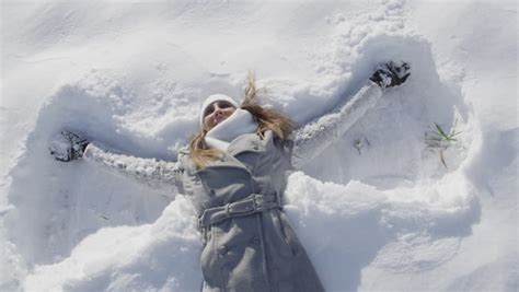 Slow Motion Young Woman Making Snow Angels Stock Footage Video 4308560