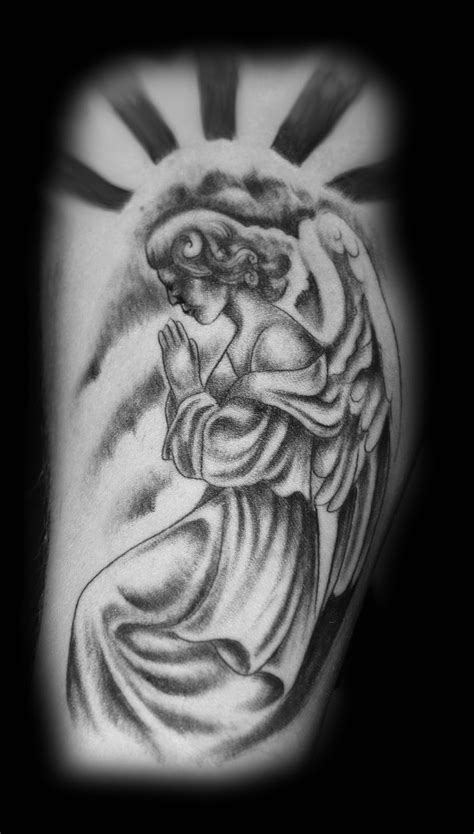 The praying hands position of the angel and the look in its eyes insure the man always has a loved one looking out. INK TATTOO: Praying angel