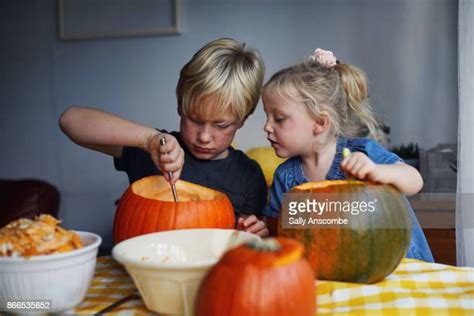 Kids Carving Pumpkins Photos And Premium High Res Pictures Getty Images