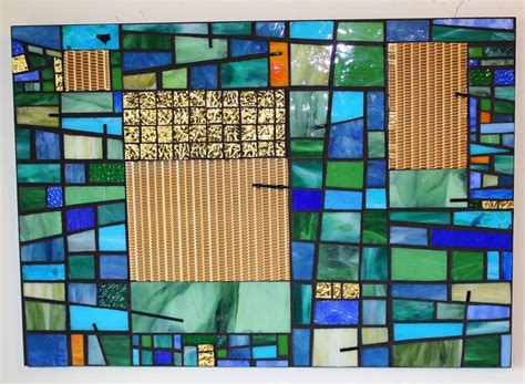 An Abstract Glass And Metal Mosaic Titled Blue Green And Gold Enjoy Mosaic