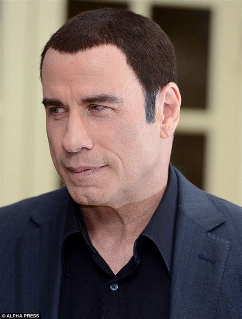 You Should Have Kept Your Hat On John Travolta Shows Off Bizarre Two