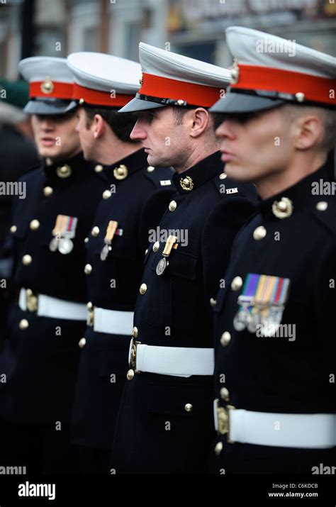 Royal Marines In Dress Uniform Amongst Mourners Gathered For A Stock