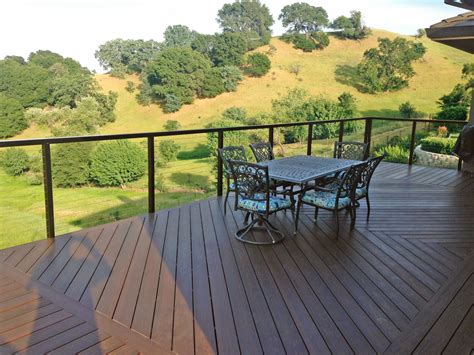 Cable railings offer outstanding views for decks. Large deck with an amazing view. Black aluminum cable ...
