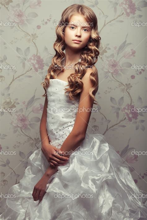 Portrait Of A Little Princess In White Vapory Classic Dress With Stock