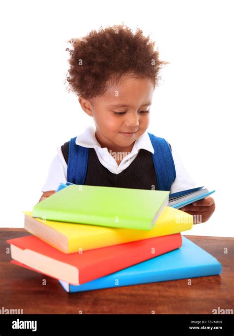Portrait Of Sweet Little Black Boy Reading Books Isolated On White