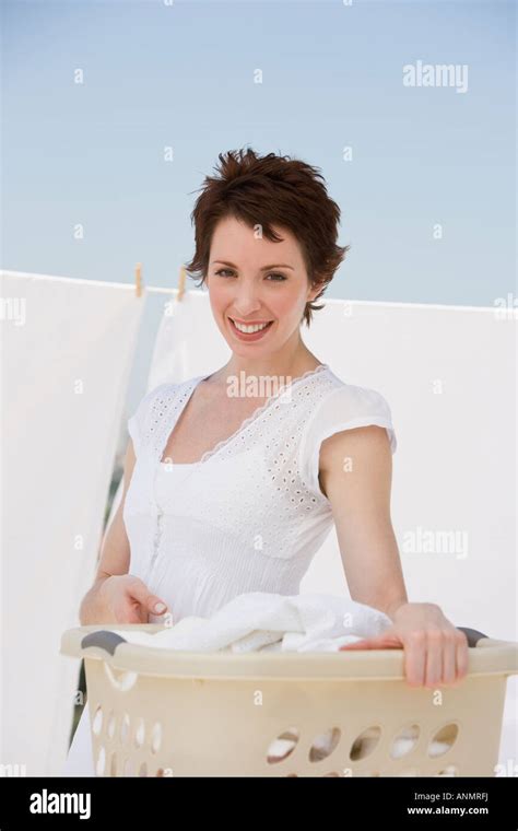 Woman Hanging Laundry On Clothes Line Stock Photo Alamy