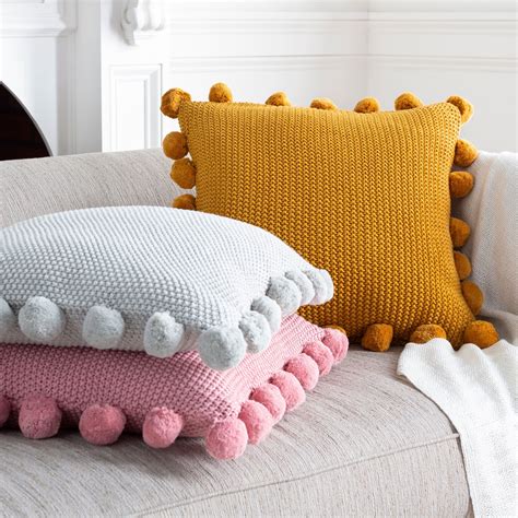 The Knitted Pom Pom Edged Pillows Of The Pam Collection Brings Cozy Style To Your Décor Space