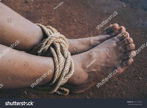close woman legs tied by rope foto stok 731174539 shutterstock