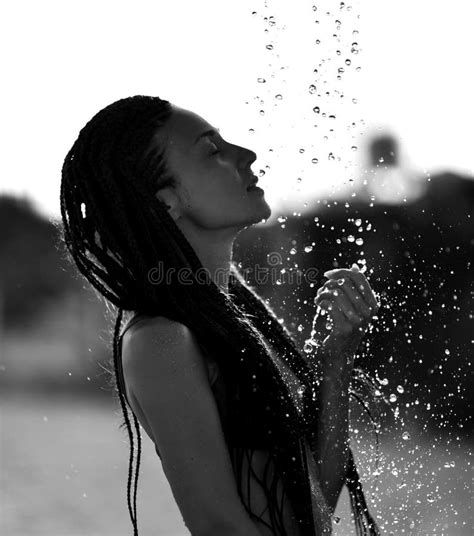 Young Woman With African Braided Dreads Standing Under Shower Water