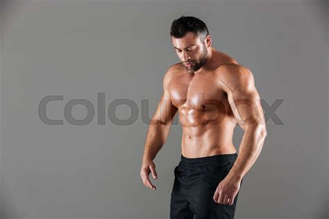Portrait Of A Concentrated Strong Shirtless Male Bodybuilder Stock
