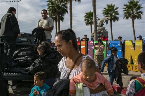 dozens from migrant caravan line up at border seeking asylum interviews the new york times