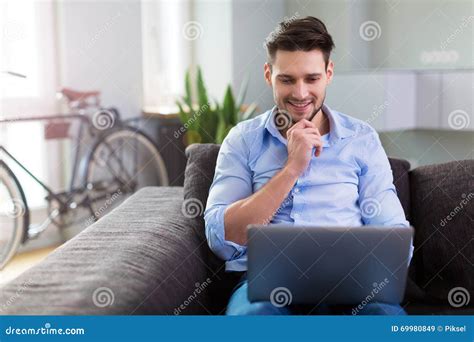 Man Sitting On Couch With Laptop Stock Image Image Of Apartment