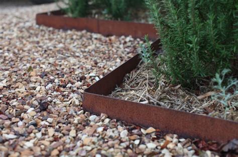 A pebble and dark brick border will fit a modern garden and will make it look edgy and stylish. Hardscaping 101: Metal Landscape Edging: Gardenista