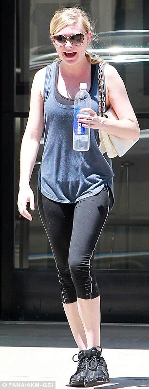 Kirsten Dunst Flashes A Smile As She Shows Off Her Lean Limbs In Sweaty