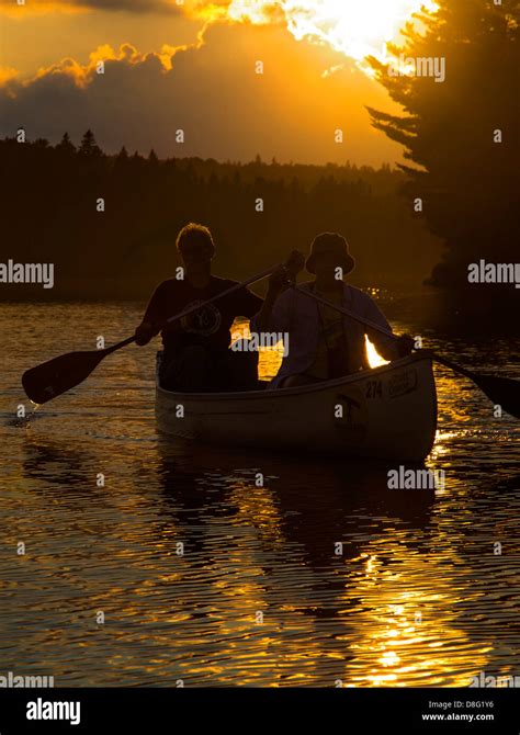 Algonquin Provincial Park Ontario Canada A Canoe At Sunset On Tom