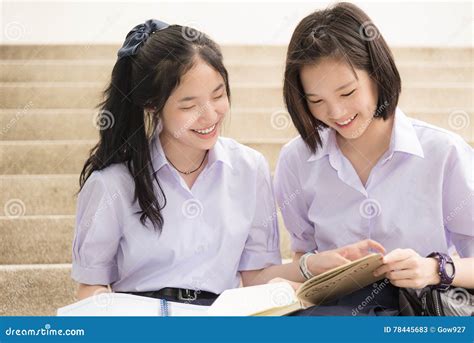 Asian Thai High Schoolgirls Student Couple In School Studying Stock