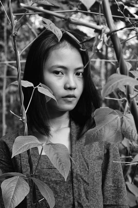 Black And White Portrait Of The Asian Woman Among The Beautiful Plants And Leaves Free Image