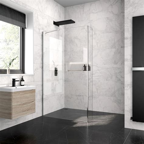 A Modern Bathroom With Marble Walls And Flooring Including A Walk In