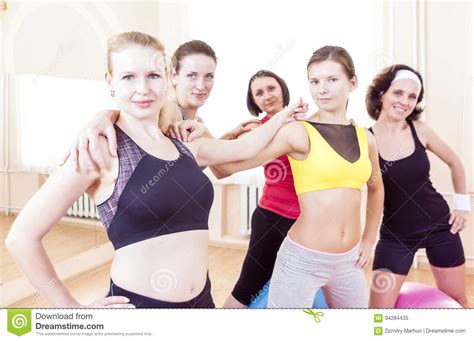 Closeup Portrait Of Five Happy Caucasian Female Athletes Posing