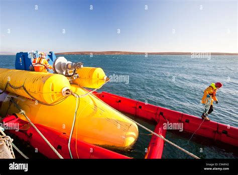 A Pelamis P2 Wave Energy Generator On The Dockside At Lyness On Hoy