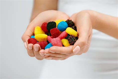 Sweets Close Up Of Colorful Candies In Hands Stock Photo Image Of
