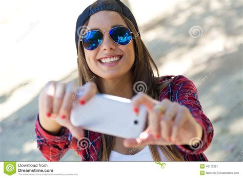 Portrait Of Beautiful Girl Taking A Selfie With Mobile Phone Stock