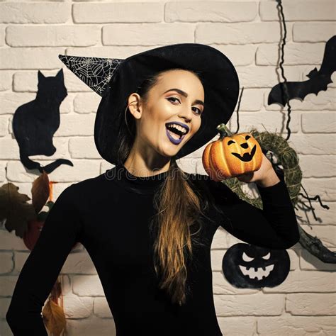 Halloween Girl Smiling In Witch Hat And Black Bodysuit Stock Image