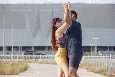 couple dancing at sunset salsa brazilian zouk lovers dance partners spinning latin festival